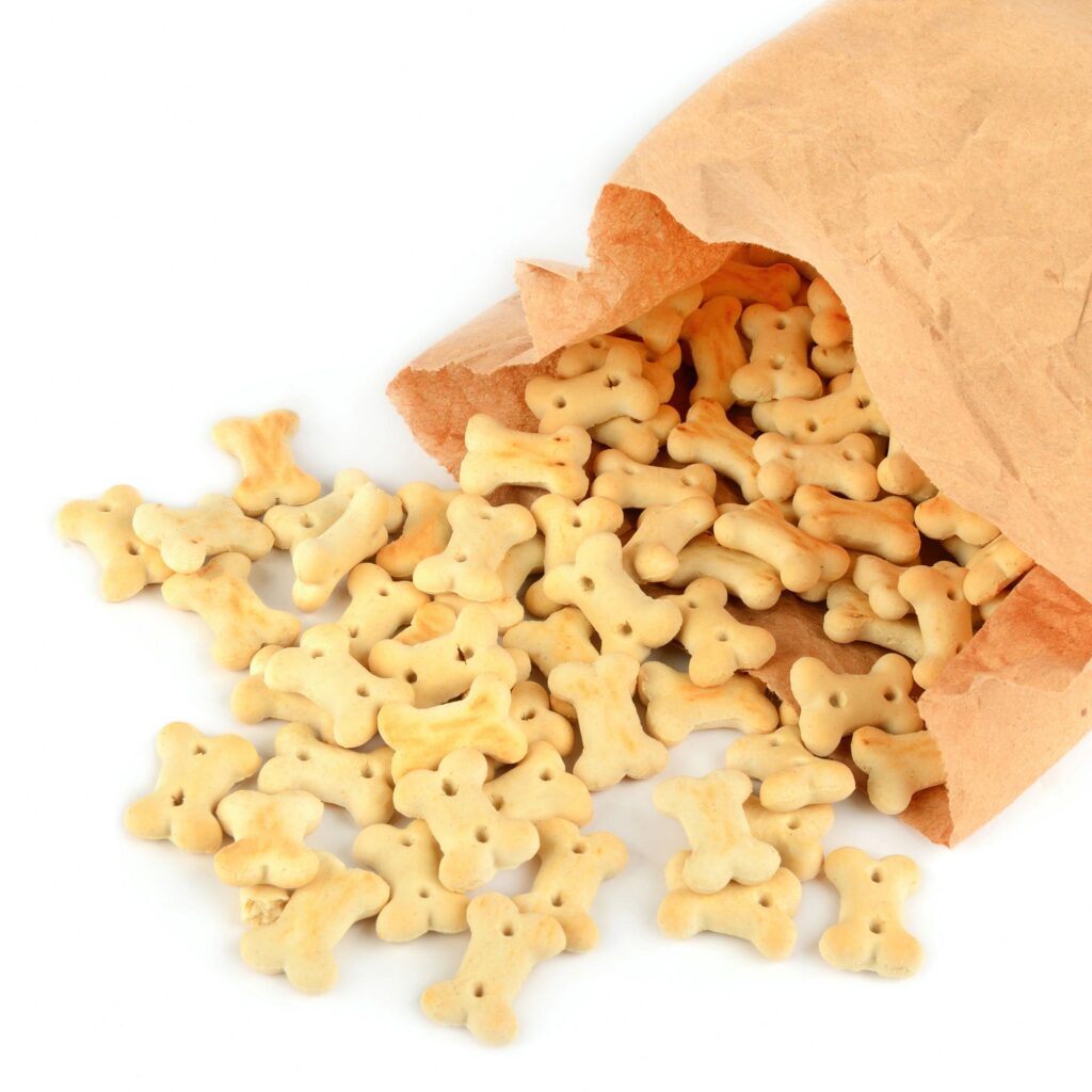 Dog Treats Spilling from a Paper Bag