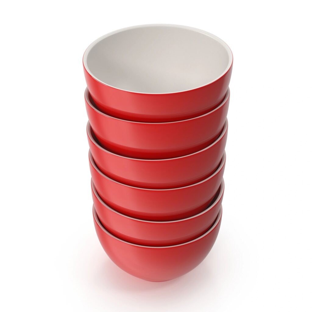 Stack of Red Ceramic Bowls on White Background